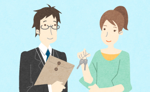 担当者から鍵を受け取っているお客様